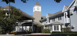 Pioneer Pointe with central clock tower and canopy-sheltered entrance