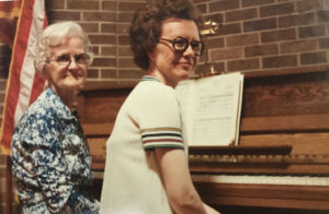 Photo of Dorothy and Carol Andstrom at a piano in 1971